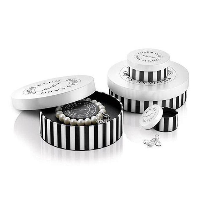 Pearl bracelet in black-and-white striped gift box.
