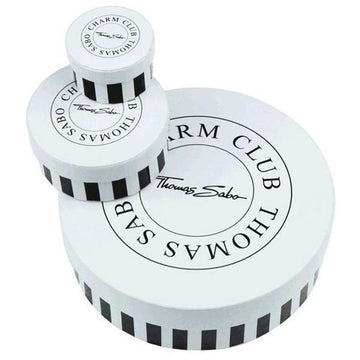 White round boxes with black stripes, featuring logo.

