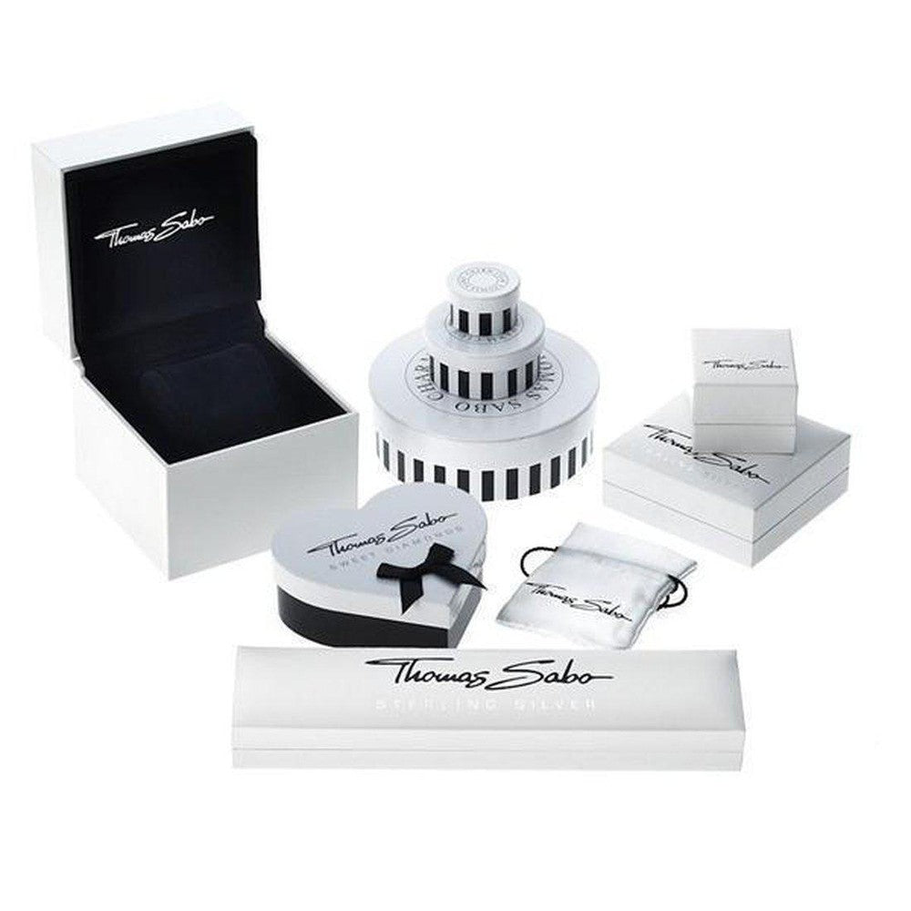 Elegant jewelry packaging; various sizes and shapes in white with black accents.
