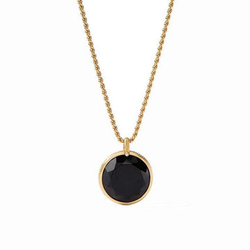 Gold chain necklace with a large, faceted black stone pendant.
