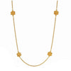 Gold Colette Station necklace with four textured floral accents.
