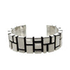 Contemporary sterling silver cuff bracelet with geometric block design.
