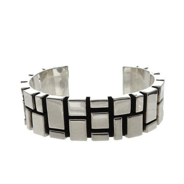 Contemporary sterling silver cuff bracelet with geometric block design.
