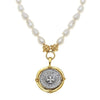 Cross Coin Pendant Necklace on Pearls: Rotating silver coin, gold frame, pearl strand.
