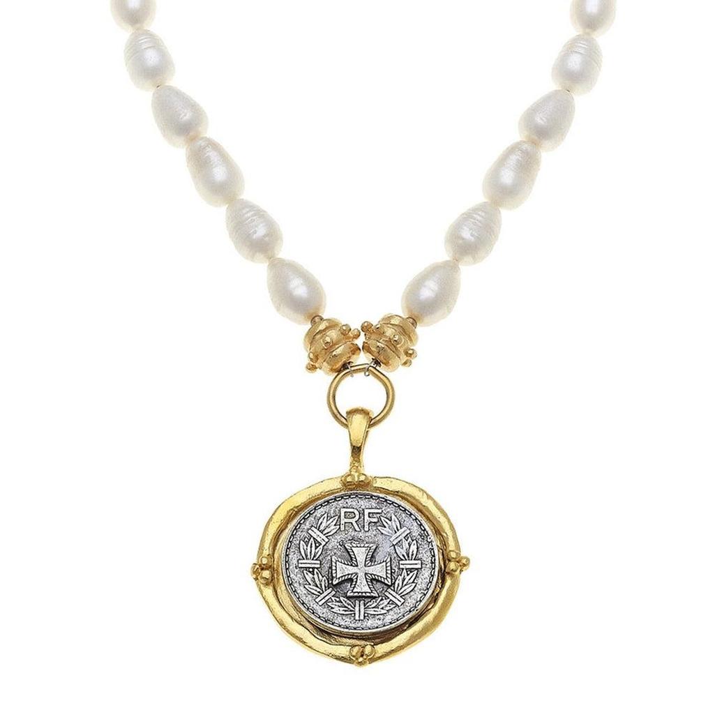 Cross Coin Pendant Necklace on Pearls: Rotating silver coin, gold frame, pearl strand.
