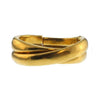Gold Crossed Cuffs bracelet, textured finish, elegant design.
