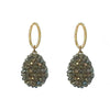 Green crystal drop earrings with gold oval accents.
