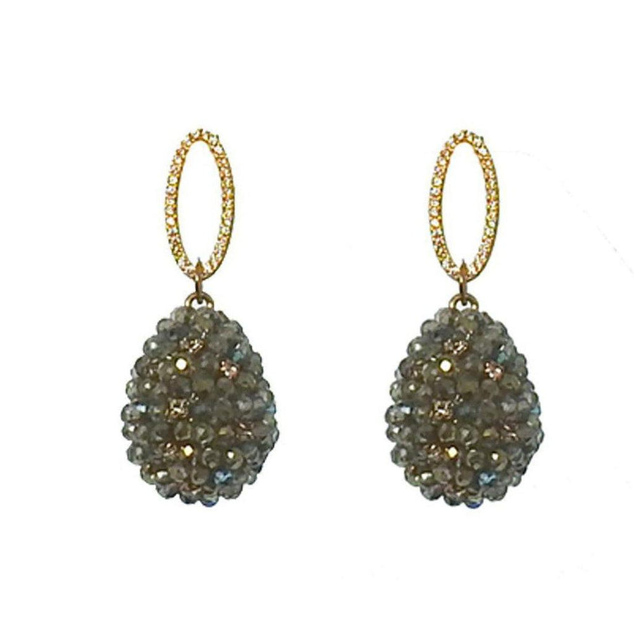 Green crystal drop earrings with gold oval accents.

