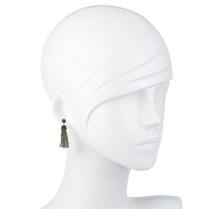 Labradorite tassel earrings on a mannequin, showcasing dark gray gemstone accents.
