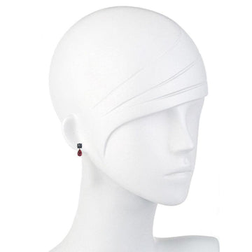 Elegant drop earrings featuring a dark blue square stone and a teardrop-shaped red gemstone.
