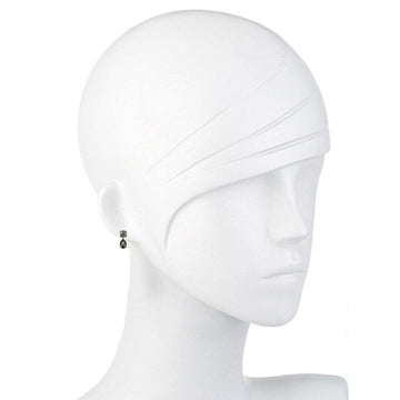 Dark gray crystal drop earrings on a mannequin.
