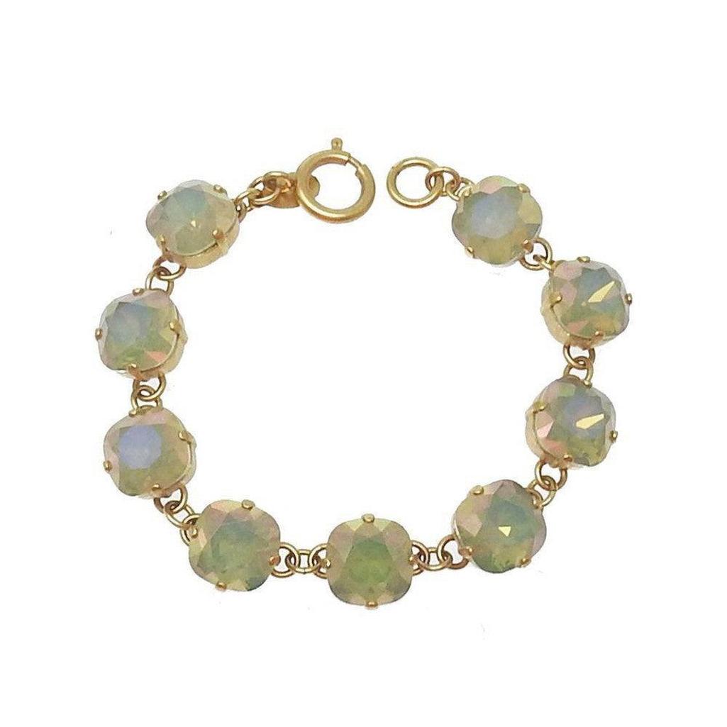 Grey Opal Cushion Cut Tennis Bracelet: Gold chain, light grey opal stones.
