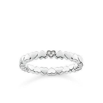Diamond Hearts Band: Sterling silver ring with tiny hearts & a sparkling center diamond.
