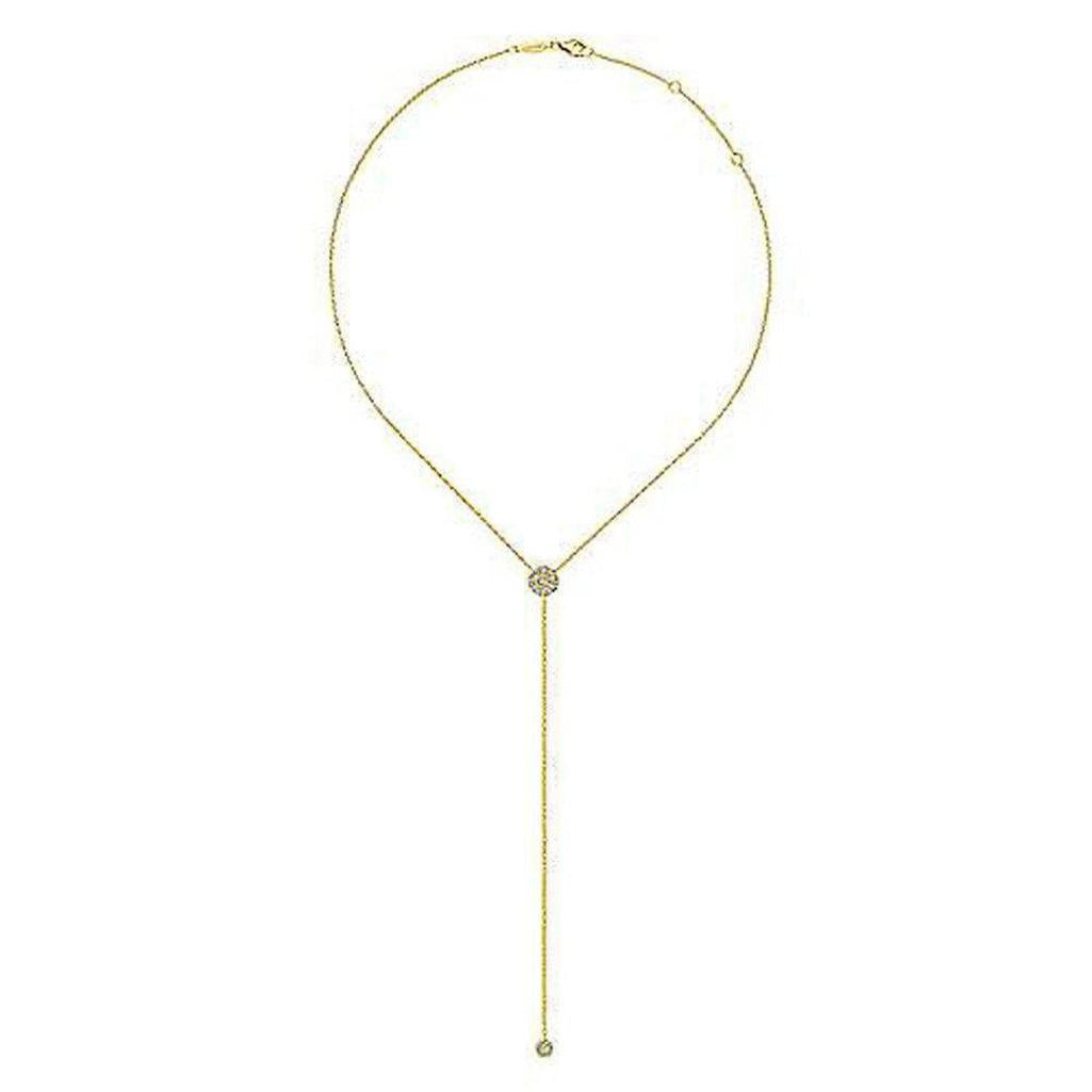 Long gold lariat necklace featuring a diamond-encrusted pendant.
