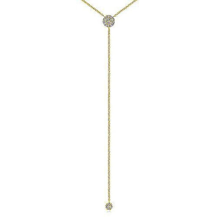 Gold diamond lariat necklace with two small pave diamond accents.
