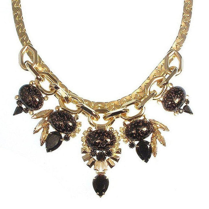 Dominique Necklace: Jet and gold statement necklace with dark stone accents.
