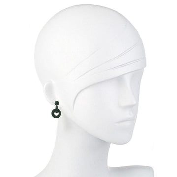 Dark green silk hoop earrings on a mannequin.
