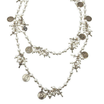 Double-strand pearl necklace adorned with antique-style charms and crosses.

