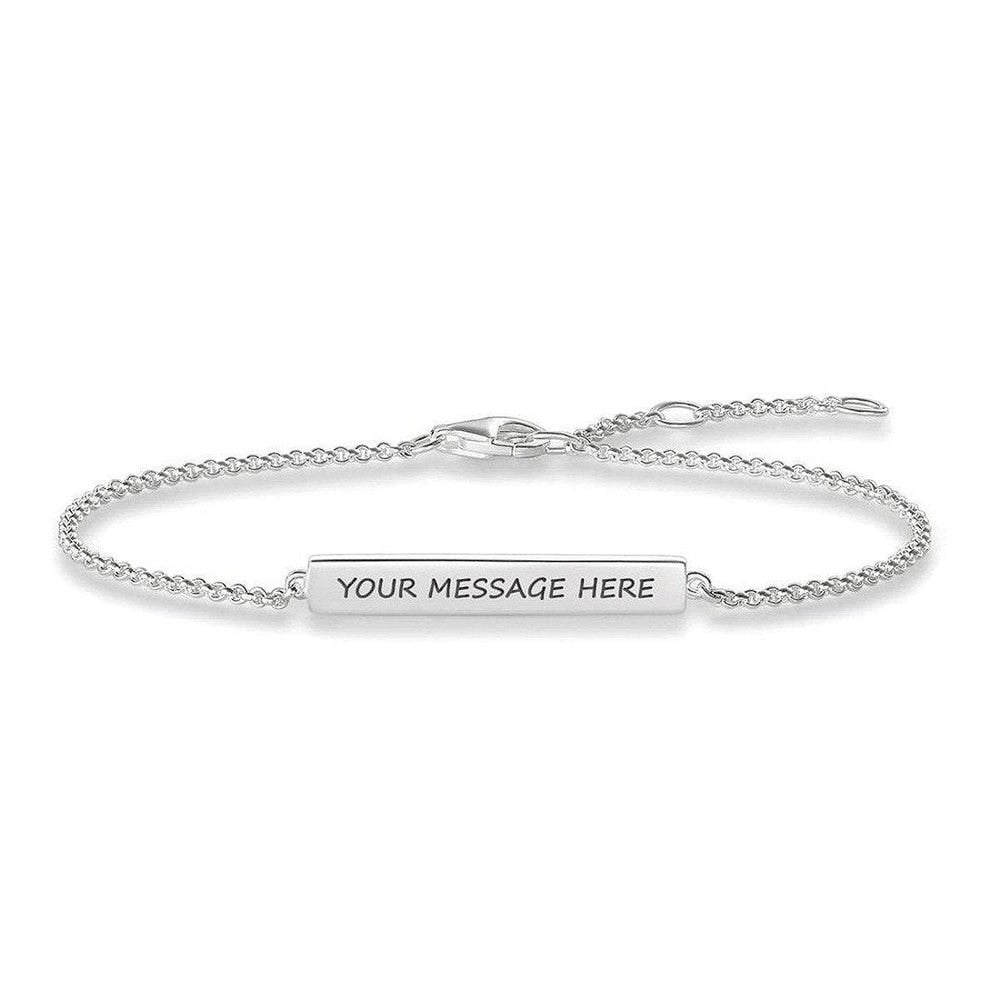 Engravable silver bar bracelet with delicate chain, personalized message.
