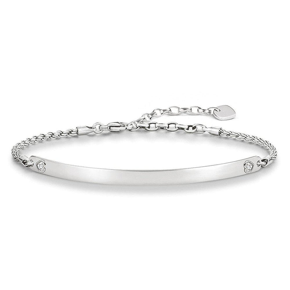 Engravable ID bracelet with silver chain and heart charm, personalized jewelry.
