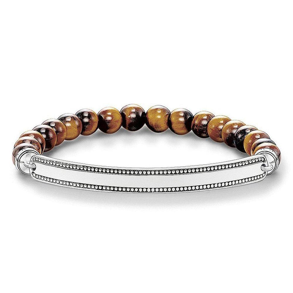 Engravable ID bracelet with tiger eye beads and sterling silver bar.
