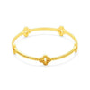 Gold Florentine bangle bracelet with textured detailing and four clover accents.
