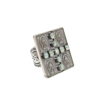 Silver Four Virgins Ring with green opal accents.
