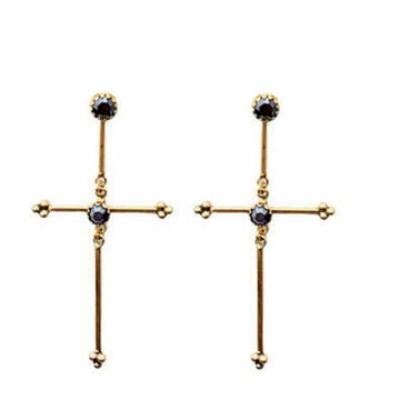Gold cross earrings with dark gemstone accents.
