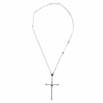 Silver cross necklace with dark stones, delicate chain.
