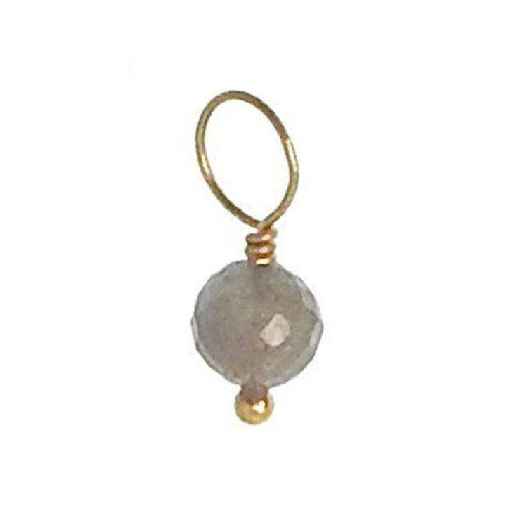 Gray gemstone pendant with gold wire accents
