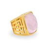 Geneva statement ring: Gold band, pink gemstone, Greek key design.
