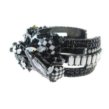 Black and white jeweled cuff bracelet with checkerboard and crystal accents.
