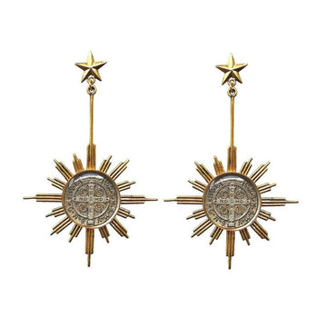 Gold sunburst earrings featuring a star and detailed medallion.
