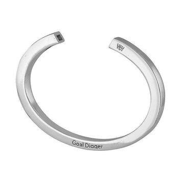 Silver cuff bracelet with a square cutout detail.
