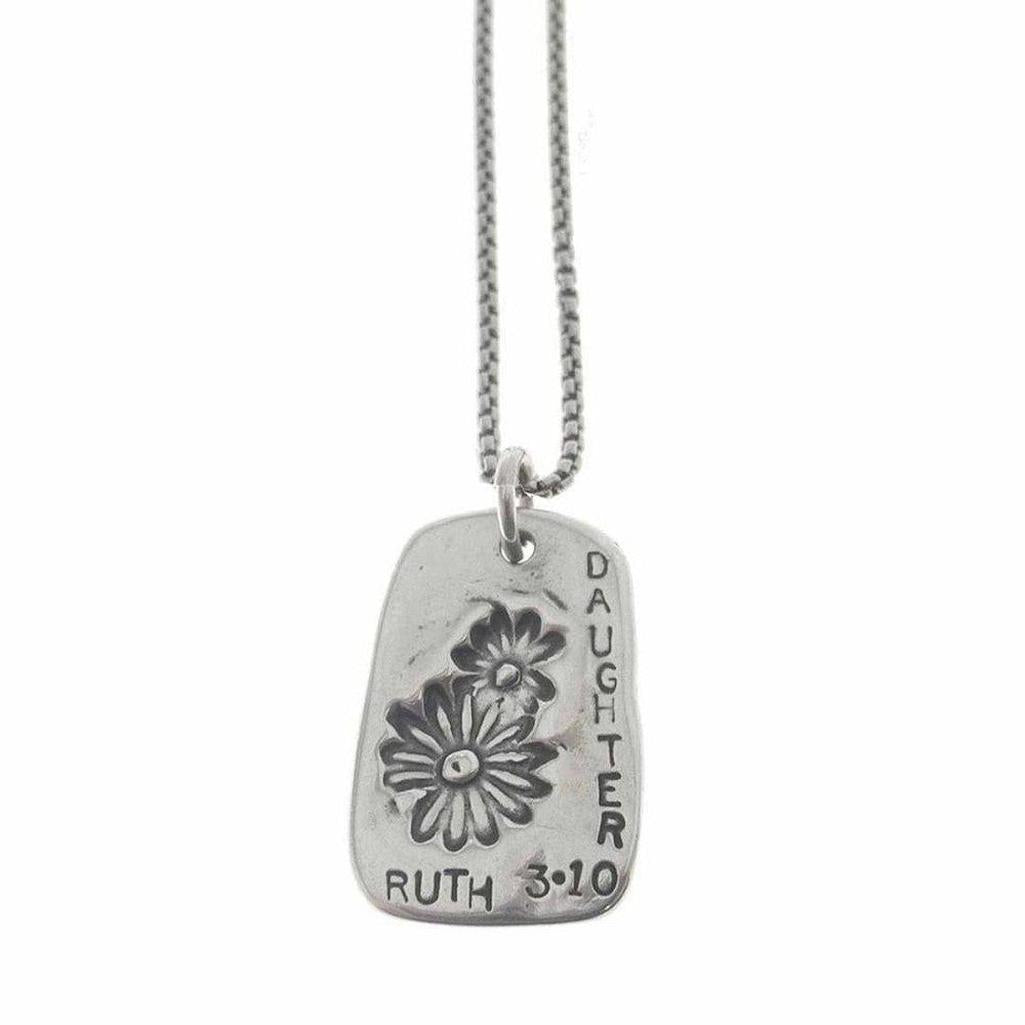 Silver necklace featuring a rectangular pendant with floral etching and "Daughter Ruth 3:10" inscription.
