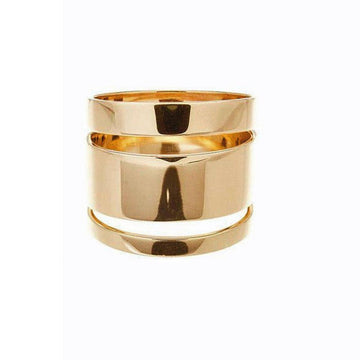 Gold statement ring, size 5, featuring a sleek, polished design with cut-out details.
