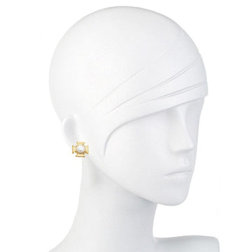 Gold cross earrings featuring a pearl center, showcased on a mannequin.
