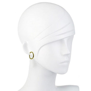 Gold oval hoop earrings on a mannequin.
