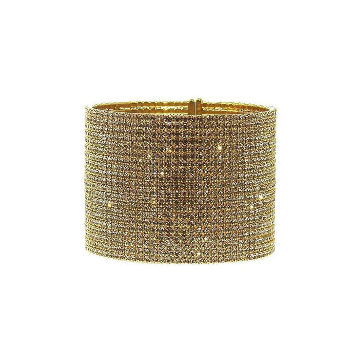 Gold pave crystal cuff bracelet, dazzling gold-tone metal base fully encrusted with sparkling crystals.
