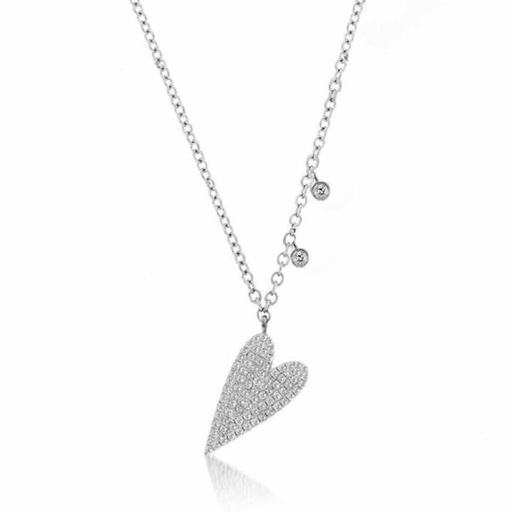 Diamond heart charm necklace with delicate chain and accents.
