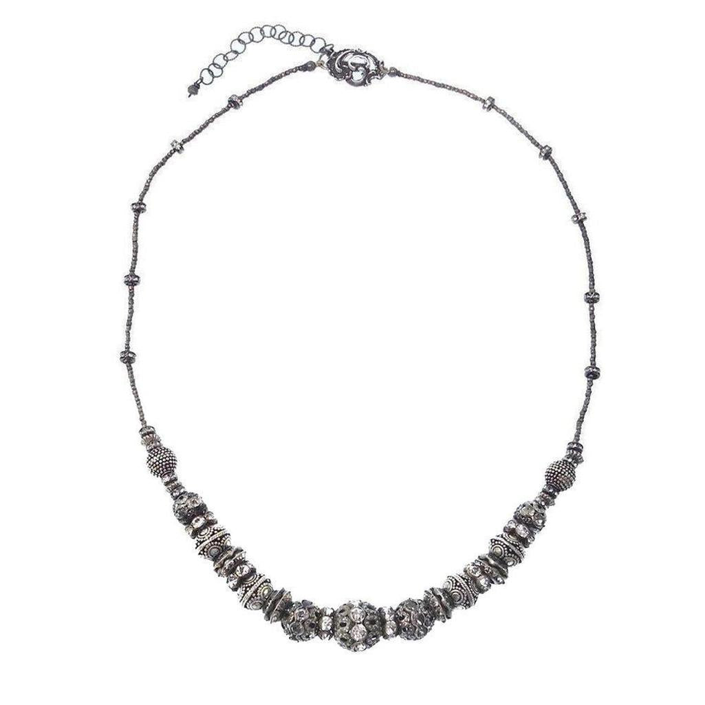 Elegant gunmetal Heishi necklace with sparkling crystal accents.
