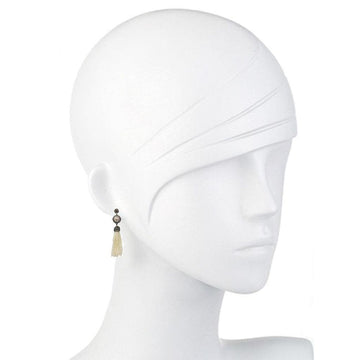 Elegant cream pearl and hematite tassel earrings on a mannequin.
