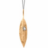 Gold leaf pendant necklace featuring a silver beetle detail.
