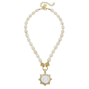 White pearl necklace featuring an antique Italian coin pendant.
