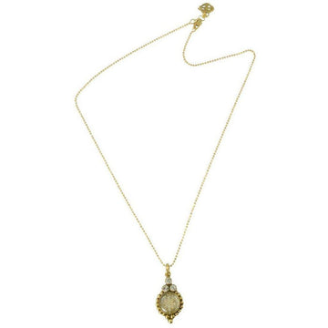 Gold chain necklace with ornate pendant featuring a clear stone and tiny accents.
