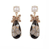 Joya Honey Drop Earrings: Rose gold earrings featuring teardrop black & white stones, pearls, and topaz accents.
