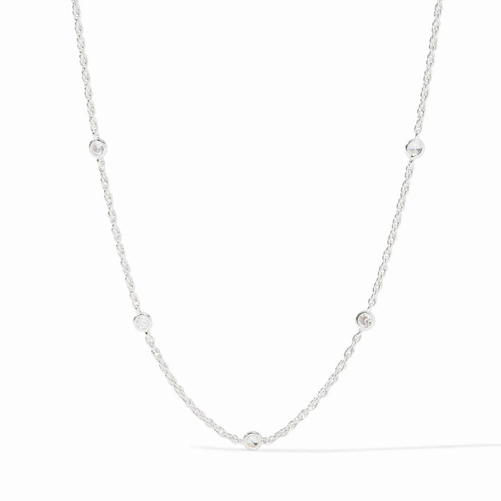 Celeste silver station necklace featuring delicate chain links and round bezel-set cubic zirconia crystals.