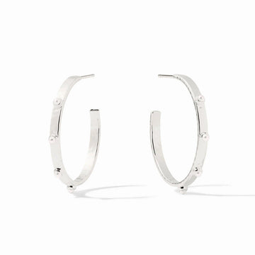 A pair of polished silver hoop earrings with small, evenly spaced round pearl-like beads set along the front, displayed on a clean white background.