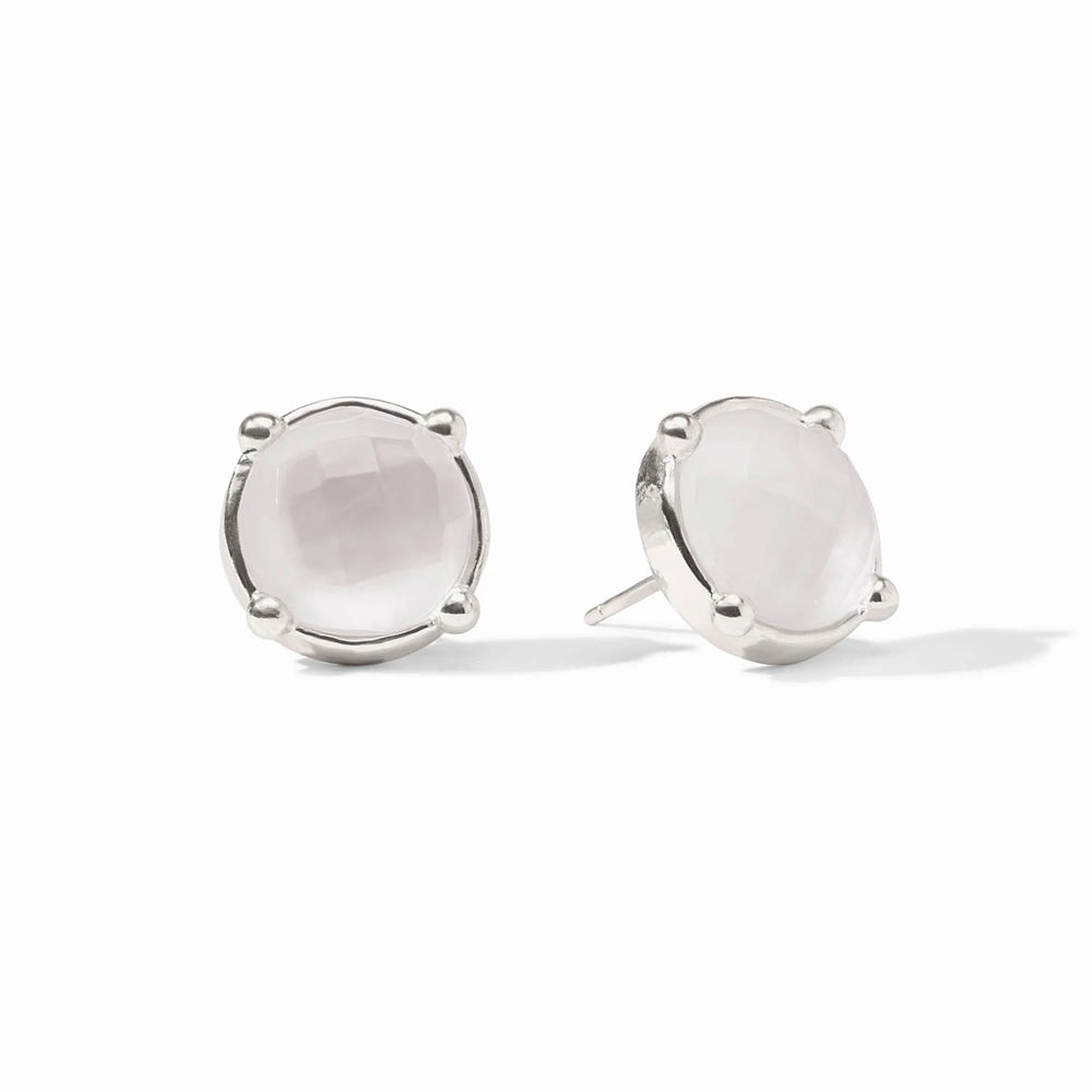 A pair of silver stud earrings with round white stones, set in silver