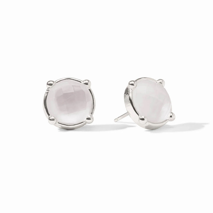 A pair of silver stud earrings with round white stones, set in silver